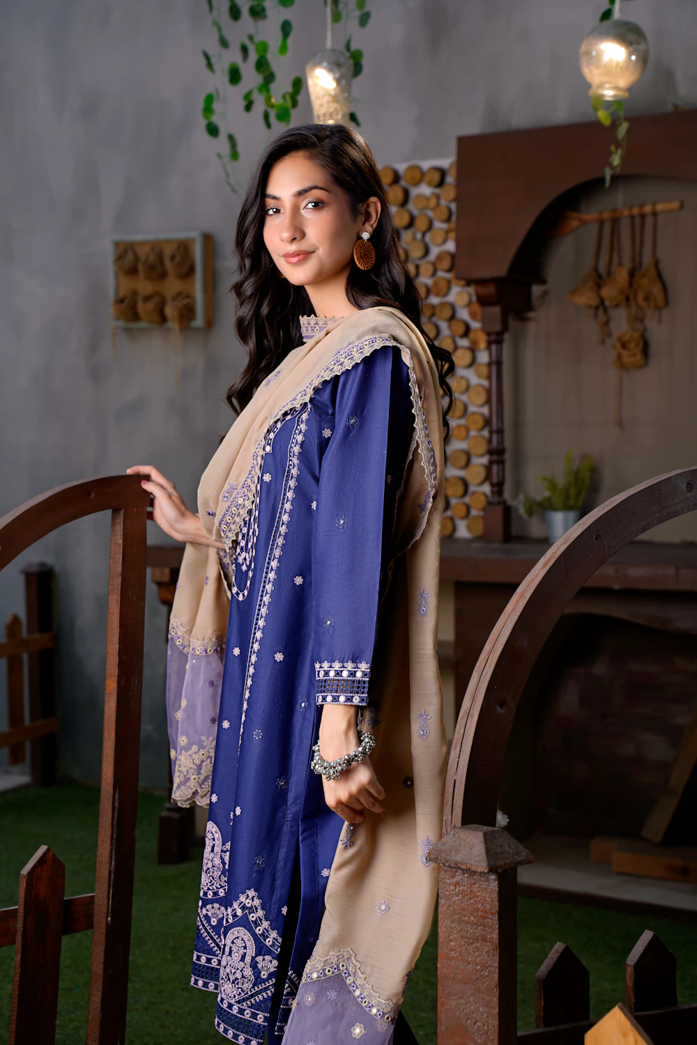 Blue embroidered lawn suit on a model