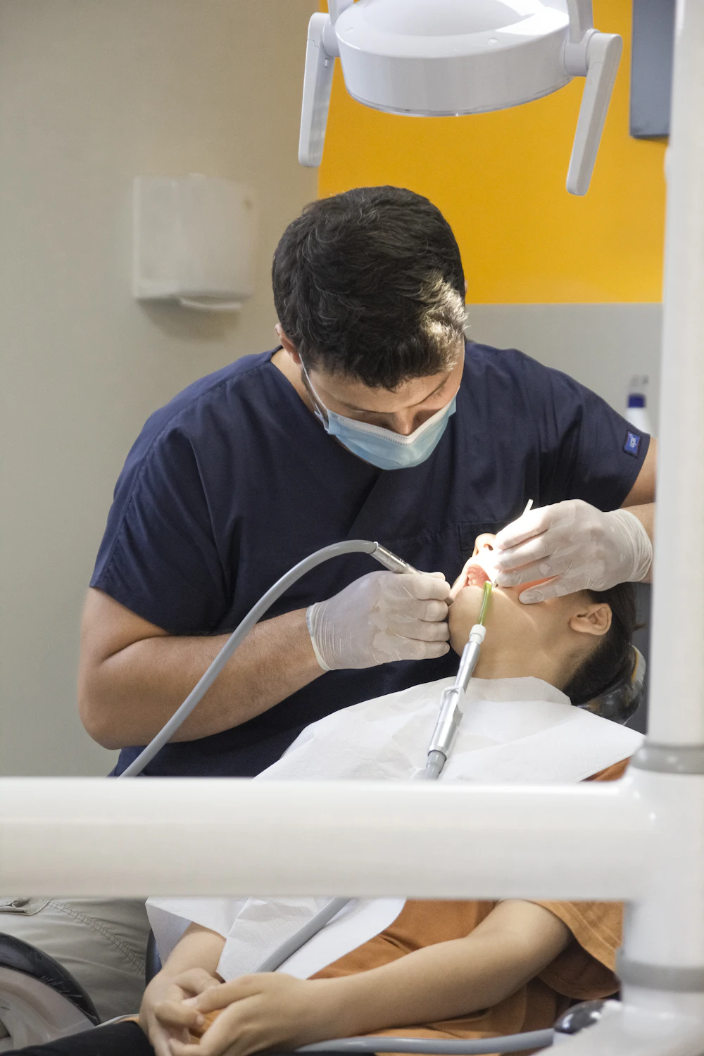 A dentist treating a patient
