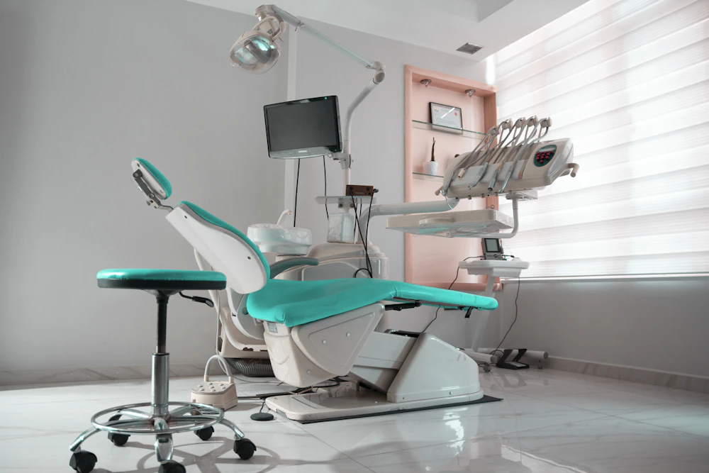 Dental treatment room with a chair and monitor